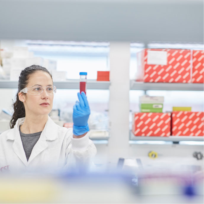 Lab worker looking at sample