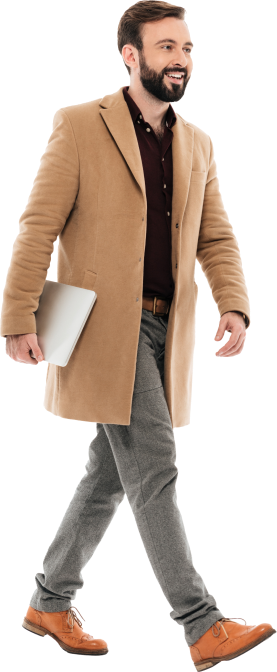 Profile of a man walking in a brown coat and smiling